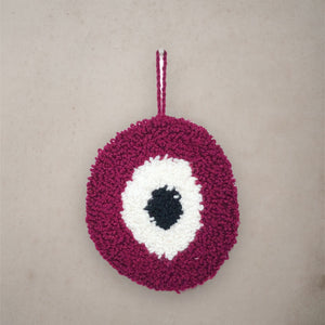 Burgundy Evil Eye Rug wall hanging